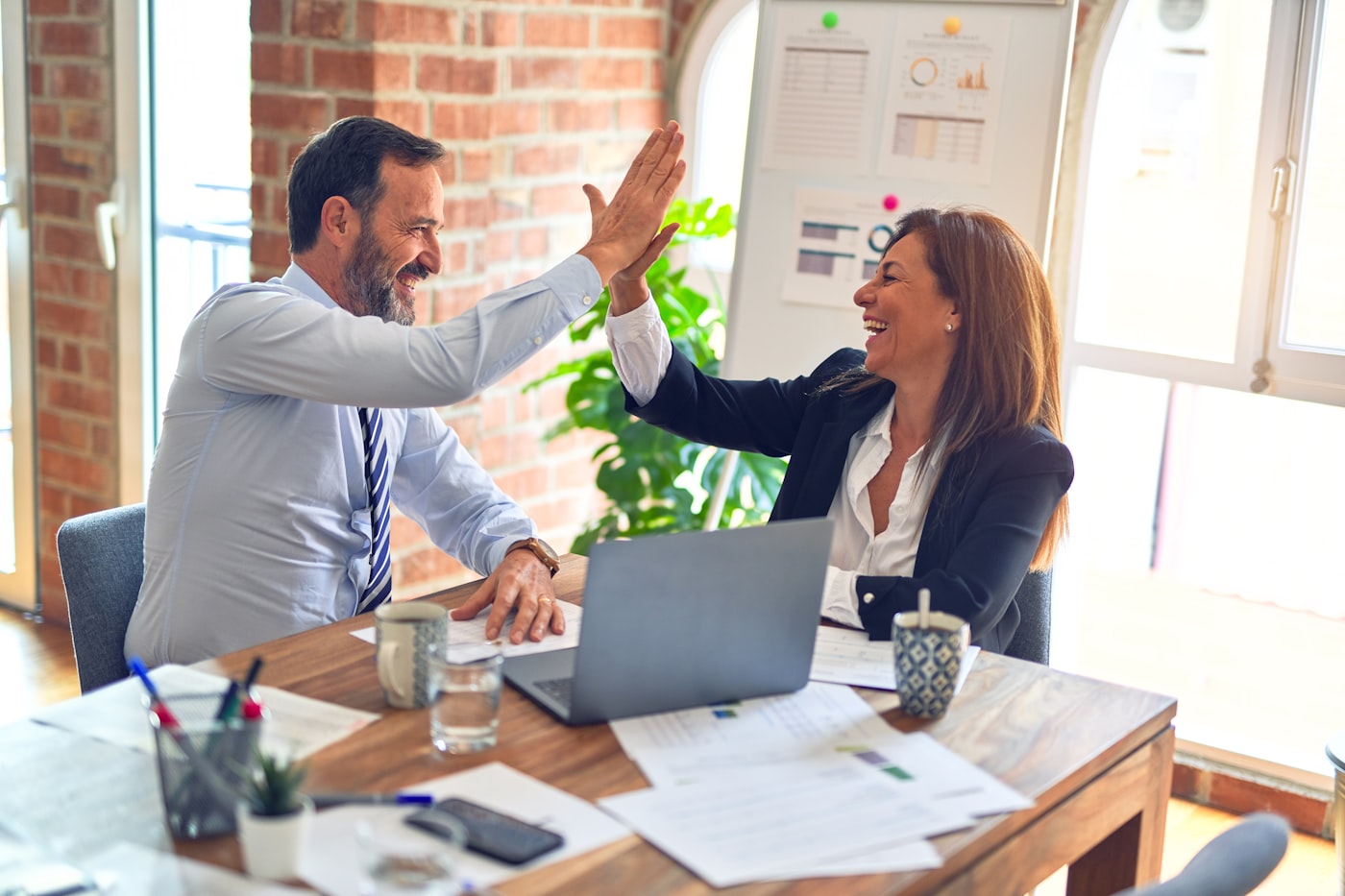 Advisors collaborating around a meeting table